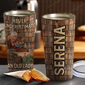 Never underestimate an old lady who loves reading books, Personalized Tumbler
